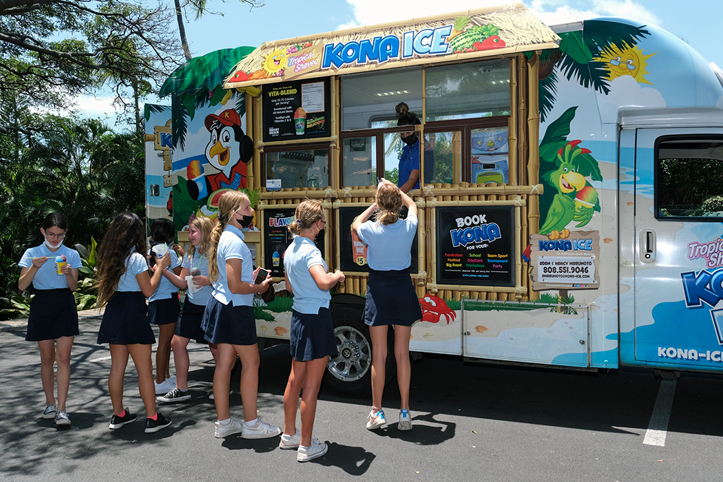 Students gather around the Kona Ice truck for a sweet treat.
